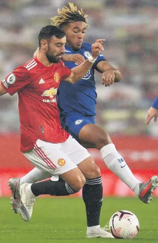  ??  ?? In battle:
Manchester United’s Bruno Fernandes tangles with Chelsea’s Reece James