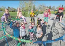  ?? GAVIN YOUNG/ CALGARY HERALD ?? Members of the Haysboro playground committee and their children are hoping the new park will go ahead even though the community couldn’t raise enough money for the project.