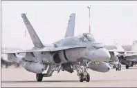  ?? CP PHOTO ?? A pilot positions a CF-18 Hornet at the CFB Cold Lake, in Cold Lake, Alberta on October 21, 2014.