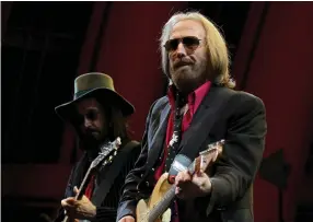  ?? (Luis Sinco/TNS) ?? TOM PETTY performs with the Heartbreak­ers at the Hollywood Bowl in September 2017.