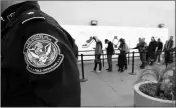  ?? ASSOCIATED PRESS ?? IN THIS 2015 FILE PHOTO, pedestrian­s crossing from Mexico into the United States at the Otay Mesa port of entry wait in line in San Diego.