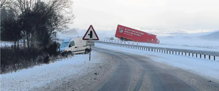  ?? Picture: Gareth Jennings. ?? A lorry and a van are victims of the dangerous conditions on the Dundee to Forfar road.