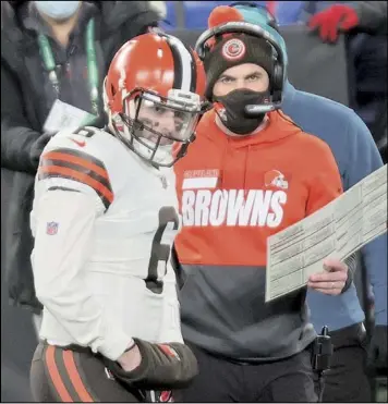  ?? Tribune News Service ?? Cleveland quarterbac­k Baker Mayfield talks with coach Kevin Stefanski during a game on Dec. 20. the Browns signal-caller is one of a group of younger leaders for AFC teams, while the NFC features older veterans.