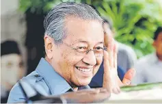  ?? — Bernama photo ?? Dr Mahathir waves to reporters after making the announceme­nt at his office, the Perdana Leadership Foundation.