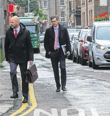  ?? PHOTO: GARETH CHANEY/COLLINS ?? Back to business: Deputy chief medical officer Ronan Glynn, Nphet chair Philip Nolan and chief medical officer Tony Holohan at Government Buildings this week.