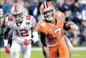  ?? Rick Scuteri Associated Press ?? MIKE WILLIAMS of Clemson, being chased by Ohio State’s Denzel Ward, overcame last year’s injury.