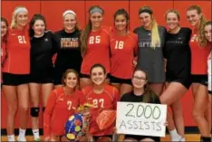  ?? SUBMITTED PHOTO ?? Members of the Perkiomen Valley girls volleyball team flank Ellie Min (27) after she posted her 2,000th career assist during Wednesday’s win against Methacton.