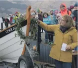  ?? Photograph: Iain Ferguson, alba.photos ?? The Corrag is officially named and launched by Christina Southcott, wife of the builder, who poured whisky over the bow.