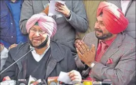  ?? GURPREET SINGH/HT ?? At the Amritsar press conference on Thursday, Navjot Singh Sidhu said about his equation with Capt Amarinder Singh: ‘Son is a son and father is a father.’ The Punjab Congress chief said about the former cricketer: ‘I am his wicketkeep­er.’