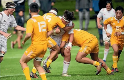  ?? DAVID UNWIN/STUFF ?? New Zealand Schools Barbarians prop Saula Mau charges forward against the New Zealand Ma¯ori under 18s yesterday.