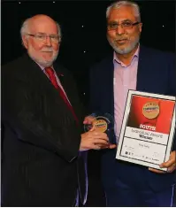  ??  ?? Raza Sadiq is given the Individual Award from Gordon Sloan, of City Building