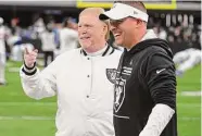  ?? Sam Morris/Getty Images ?? Las Vegas owner Mark Davis laughs with head coach Josh McDaniels prior to the Raiders’ loss to Indy.