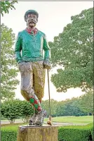  ?? Jan Halgrim/Bella Vista Photograph­y Club ?? A hand-carved Mr. Mulligan welcomes golfers to the Highlands Club House in Bella Vista.