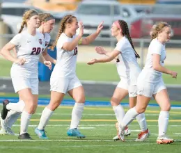  ?? STEVE JOHNSTON/DAILY SOUTHTOWN ?? Lincoln-Way Central’s Grace Grundhofer (16) and Emma Vogler, second from right, celebrate the game-winning goal against Glenbard West during the Class 3A Sandburg Supersecti­onal in Orland Park on Tuesday.