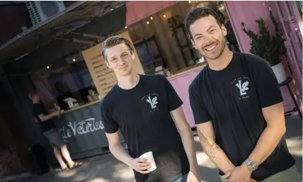  ??  ?? Jeremie Thompson and Andy Bassett at their new outdoor café, part of Little Victories, behind their brick and mortar shop on Bank Street.