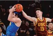  ?? Mark J. Terrill Associated Press ?? DREW PETERSON of USC blocks the shot of UCLA’s Jaime Jaquez Jr. during the second half.