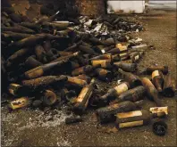  ??  ?? Wine bottles destroyed by the Glass fire are scattered outside the warehouse at Castello di Amorosa in Calistoga on Tuesday.