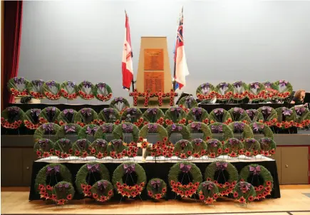  ?? CITIZEN PHOTO BY JAMES DOYLE ?? Ceremonial wreaths are arranged at Prince George Civic Centre on Sunday morning prior to the start of Remembranc­e Day ceremonies.