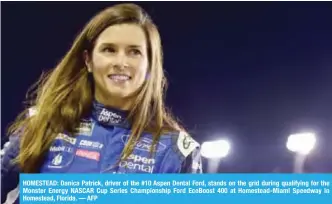  ??  ?? HOMESTEAD: Danica Patrick, driver of the #10 Aspen Dental Ford, stands on the grid during qualifying for the Monster Energy NASCAR Cup Series Championsh­ip Ford EcoBoost 400 at Homestead-Miami Speedway in Homestead, Florida. — AFP