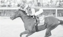  ?? LAUREN KING/GULFSTREAM PARK ?? Irish War Cry, with Joel Rosario in the irons, wins the GII Holy Bull Stakes at Gulfstream Park on Saturday.