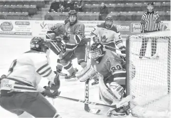  ?? [FAISAL ALI / THE OBSERVER] ?? Matthew Tolton sweeps around the side of the Stratford net at Sunday evening’s home game, which the Kings lost 5-1.