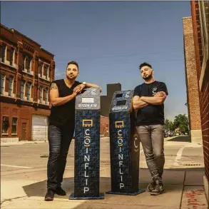  ?? Contribute­d by CoinFlip Inc. / www.jboehmphot­o.com ?? Two executives, Daniel Polotsky and Ben Weiss, from crypto-ATM company CoinFlip pose next to their company's machines.