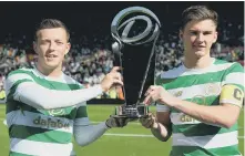  ??  ?? Callum McGregor and Kieran Tierney lift the Dafabet Cup.
