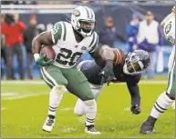  ?? Nam Y. Huh / Associated Press ?? Jets running back Isaiah Crowell runs against Bears linebacker Leonard Floyd in an Oct. 28 game. When the Jets run the ball Sunday, it will be a test of their blocking against the Dolphins’ tackling to see who’s worse.