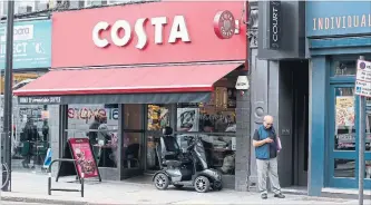  ?? NISHAT AHMED THE ASSOCIATED PRESS ?? Coca-Cola said Friday it will buy the Britain's biggest coffee company, Costa, from Whitbread for US$5.1 billion in cash.