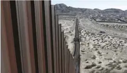  ??  ?? A truck drives near the Mexico-US border fence, on the Mexican side, separating the towns of Anapra, Mexico and Sunland Park, New Mexico. — AP