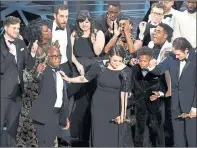  ??  ?? REAL WINNERS: Moonlight cast and crew members accept award.