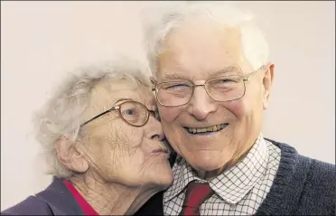  ?? (27273552) ?? Lawrence Lyle receives a kiss from wife Marjorie as he is named in the 2012 New Year’s Honours List