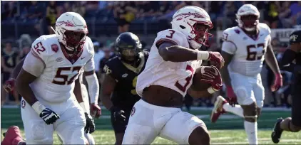  ?? (AP PHOTO/CHUCK BURTON) ?? The Florida State Seminoles were fourth in the initial College Football Playoff rankings released this week. Florida State has won 14 straight games, the longest active streak in the ACC and third-longest in the country.