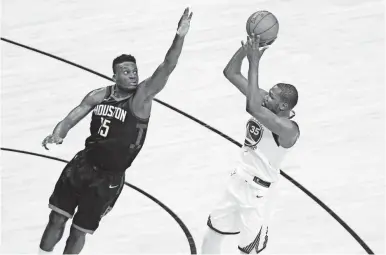  ?? ERIK WILLIAMS/USA TODAY SPORTS ?? Stopping Warriors forward Kevin Durant was a tough task for Clint Capela and the Rockets in Game 1 on Monday in the Western Conference finals.