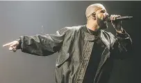  ?? APRIL GREER/THE WASHINGTON POST ?? Drake performs in August. His song, ‘Motto’ champions YOLO — you only live once.