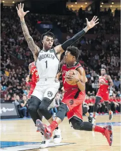  ?? GRAHAM HUGHES / THE CANADIAN PRESS ?? Toronto Raptors’ Kyle Lowry, right, says the NBA club has all the right ingredient­s to go far this season.
