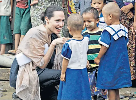  ??  ?? Cause celeb: Angelina Jolie, left, is a vocal UN ambassador, while Minnie Driver, below, has parted from Oxfam