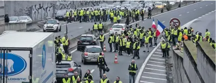  ??  ?? Thousands march in France over diesel tax.