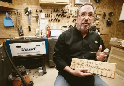  ?? Melissa Phillip / Houston Chronicle ?? John Leslie makes wooden jewelry and other gifts that he sells through Amazon Handmade. “I don’t see it coming to an end unless the laser cuts my fingers off,” Leslie said of his work with the online retailer.