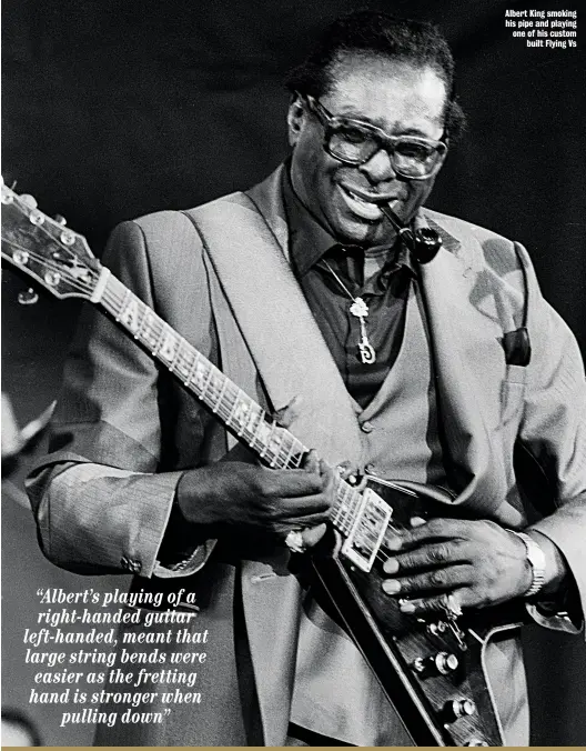  ??  ?? Albert King smoking his pipe and playing one of his custom built Flying Vs