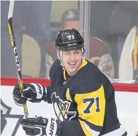  ??  ?? The Penguins’ Evgeni Malkin celebrates his second goal of the third period.