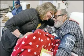  ?? Special to the Democrat-Gazette/JEFF BOWEN ?? Susan Cookus comforts Army veteran Dannie Walker in the dialysis unit of John L. McClellan Memorial Veterans Hospital in Little Rock. She was named the 2016-17 Female Volunteer of the Year by the National Advisory Committee of the Department of Veterans Affairs Voluntary Services.