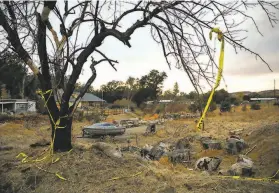  ??  ?? Howard Murray’s property off Quarterhor­se Lane in Lower Lake is marked with caution tape after it burned in the Clayton Fire, which Pashilk started.