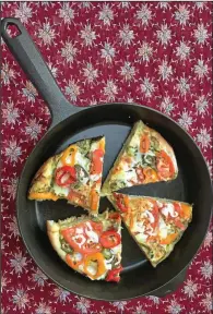  ?? (TNS/Pittsburgh Post-Gazette/Arthi Subramania­m) ?? A Garden Vegetable Pizza topped with basil pesto, tomatoes, mini yellow and red peppers, jalapenos and mozzarella cheese.