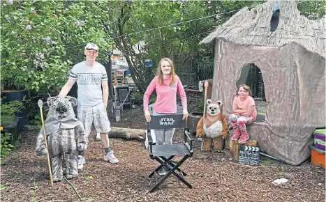  ??  ?? The Force is certainly strong with Mark Donald, pictured with daughters Nicole (12) and Caitlyn (eight), who has recreated Star Wars in his garden. Below: Which type of wave do you like to give fellow motorists?