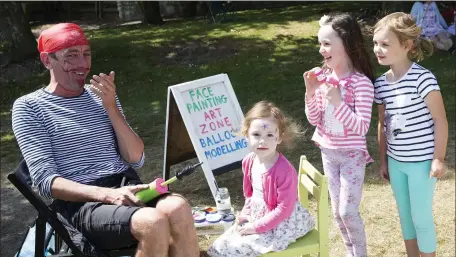  ??  ?? Ellie Naughton, Olivia Jordan and Éabha O’Shaughness­y waiting to get their face painted by the Face Painting Pirate at the Triple A family fun day at Greystones Rugby Club