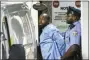  ?? ELIZABETH ROBERTSON- THE ASSOCIATED PRESS ?? Police take shooting suspect, Maurice Hill, into custody after an hourslong standoff with police, that wounded several police officers, in Philadelph­ia early Thursday.