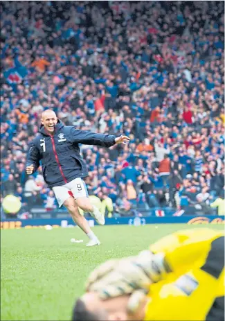  ??  ?? AGONY AND ECSTASY: Celtic keeper Craig Gordon can’t bear to look as Rangers start their celebratio­ns