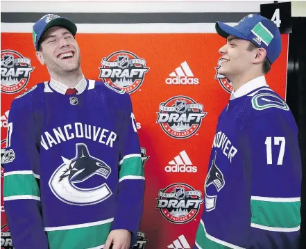  ?? — GETTY IMAGES ?? Forward Jonah Gadjovich, left, and goalie Michael DiPietro share a laugh after being drafted by the Canucks during the 2017 NHL Entry Draft at the United Center Saturday in Chicago.