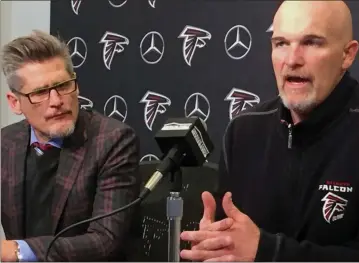  ?? Charles Odom / AP ?? Atlanta Falcons General Manager Thomas Dimitroff (left) and head coach Dan Quinn speak at the team’s training facility in Flowery Branch. Quinn reviewed the 2017 season and said offensive coordinato­r Steve Sarkisian will return next season.